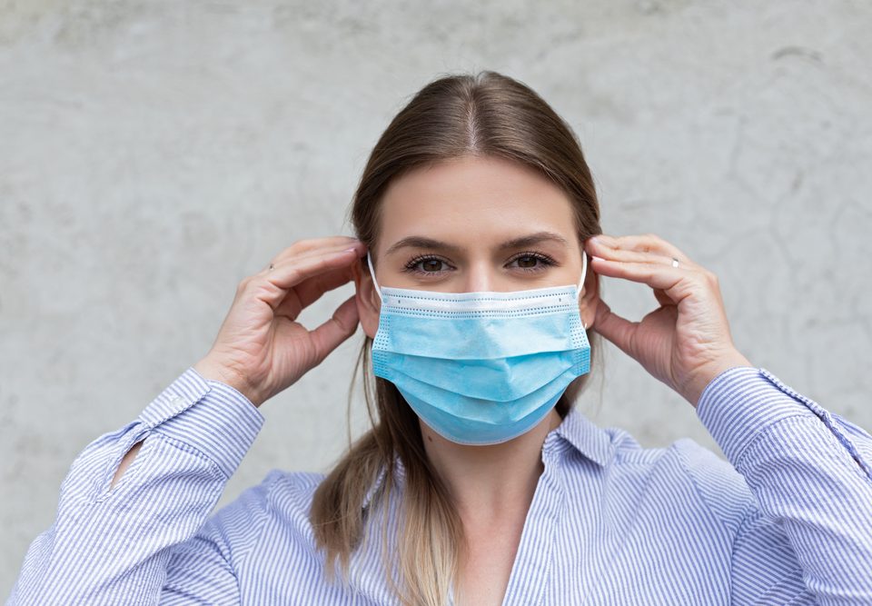 Young caucasian woman wearing surgical mask - coronavirus quarantine